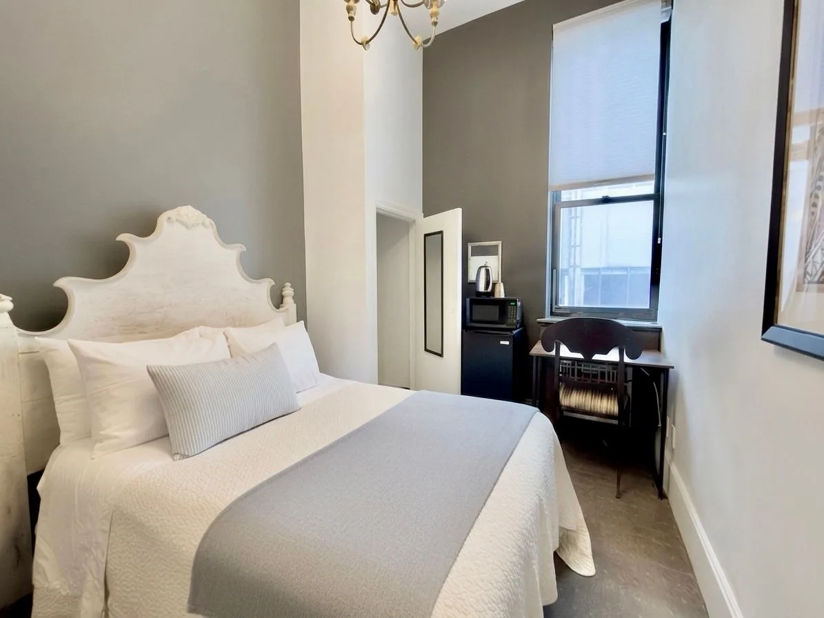 Seton Deluxe room with full-size bed and desk