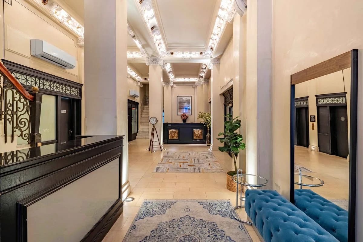 Mansfield lobby with ornate ceiling and front desk