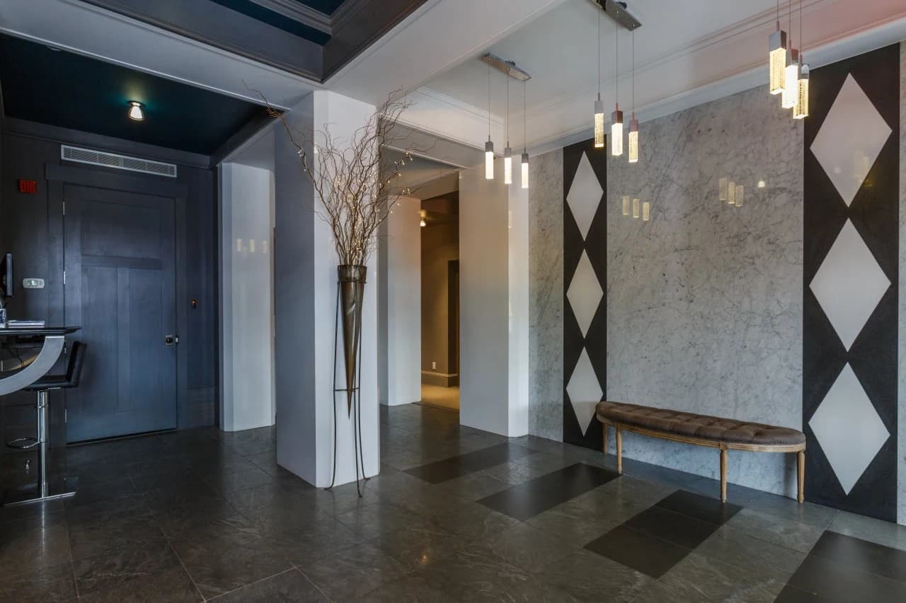 Seton lobby with marble wall and pendant lights