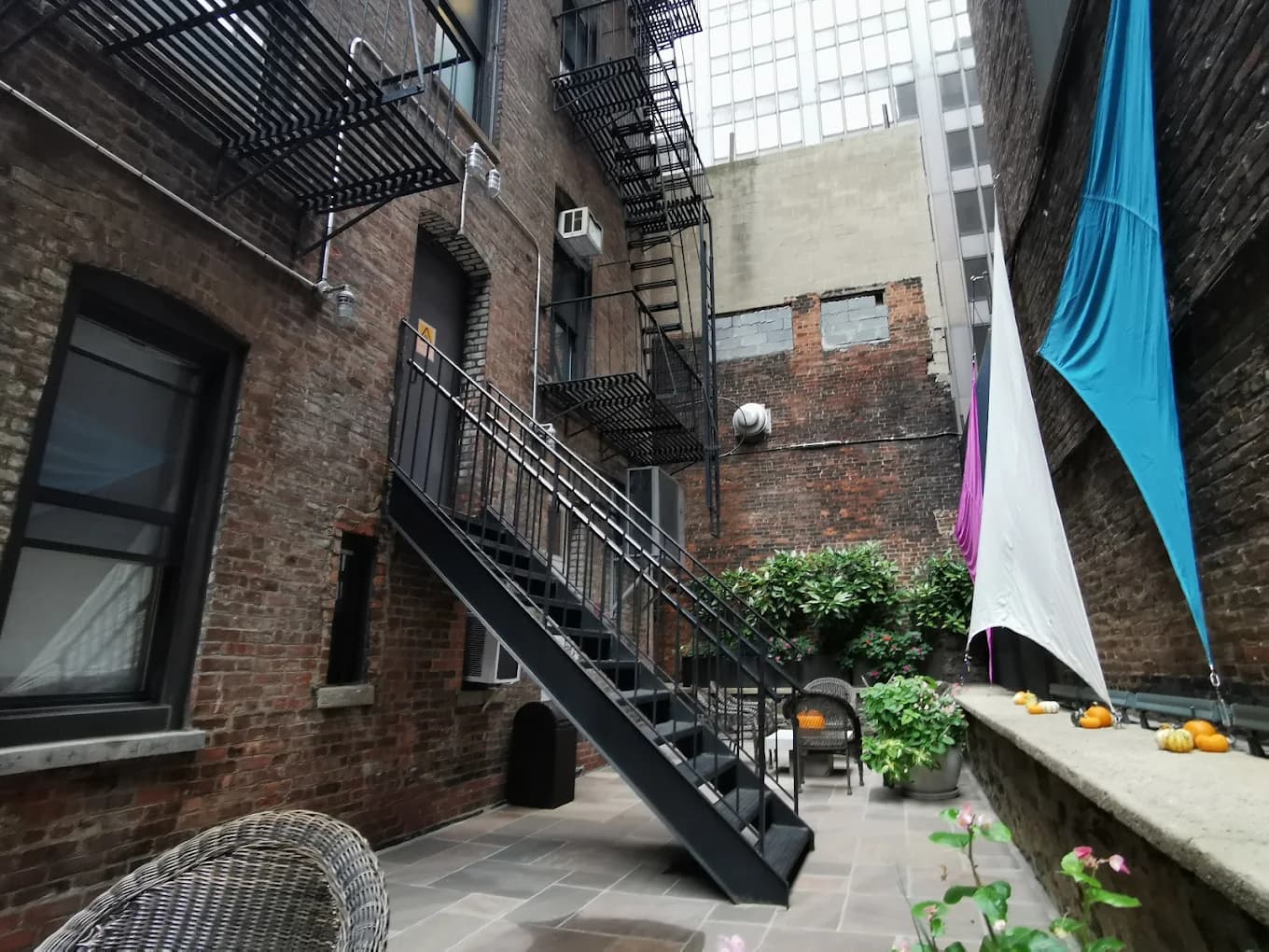 Seton courtyard with brick walls and shade sails